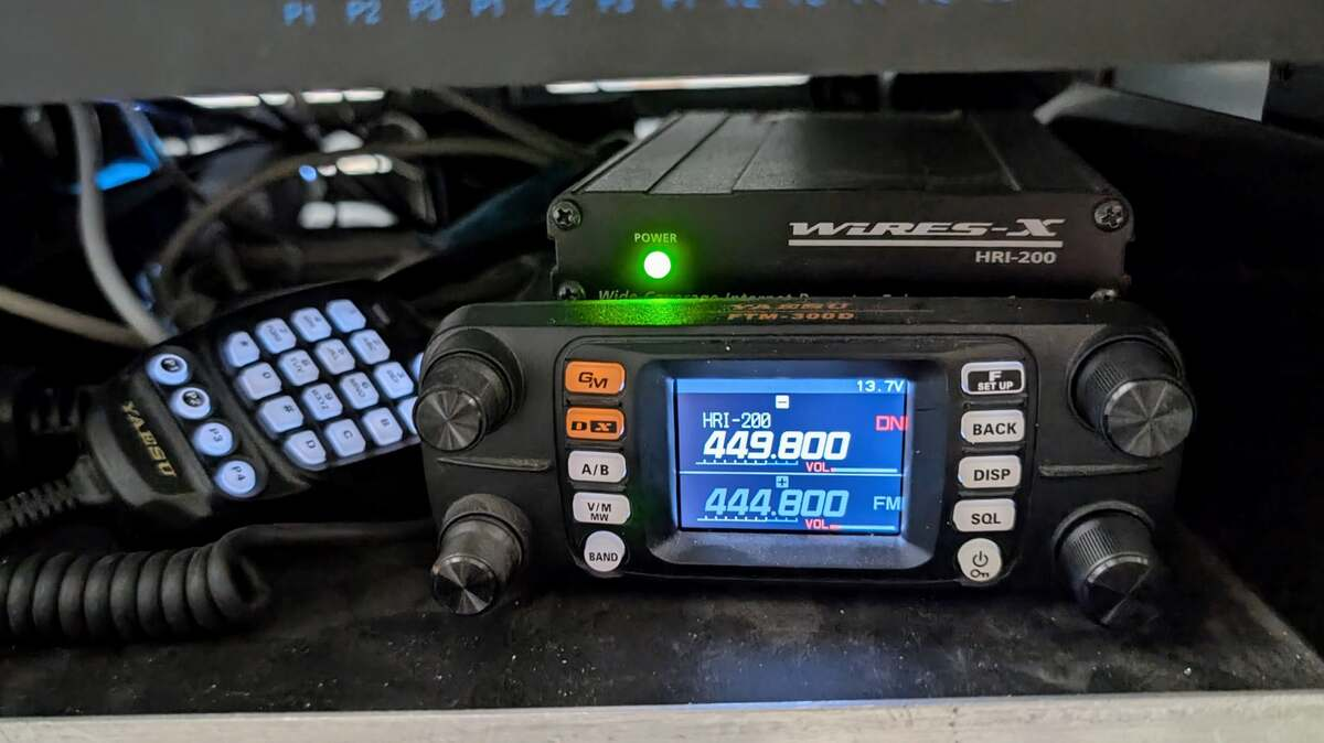 Yaesu FTM-300D linking radio displaying 449.800 and 444.800 MHz beneath an HRI-200 WIRES-X interface.